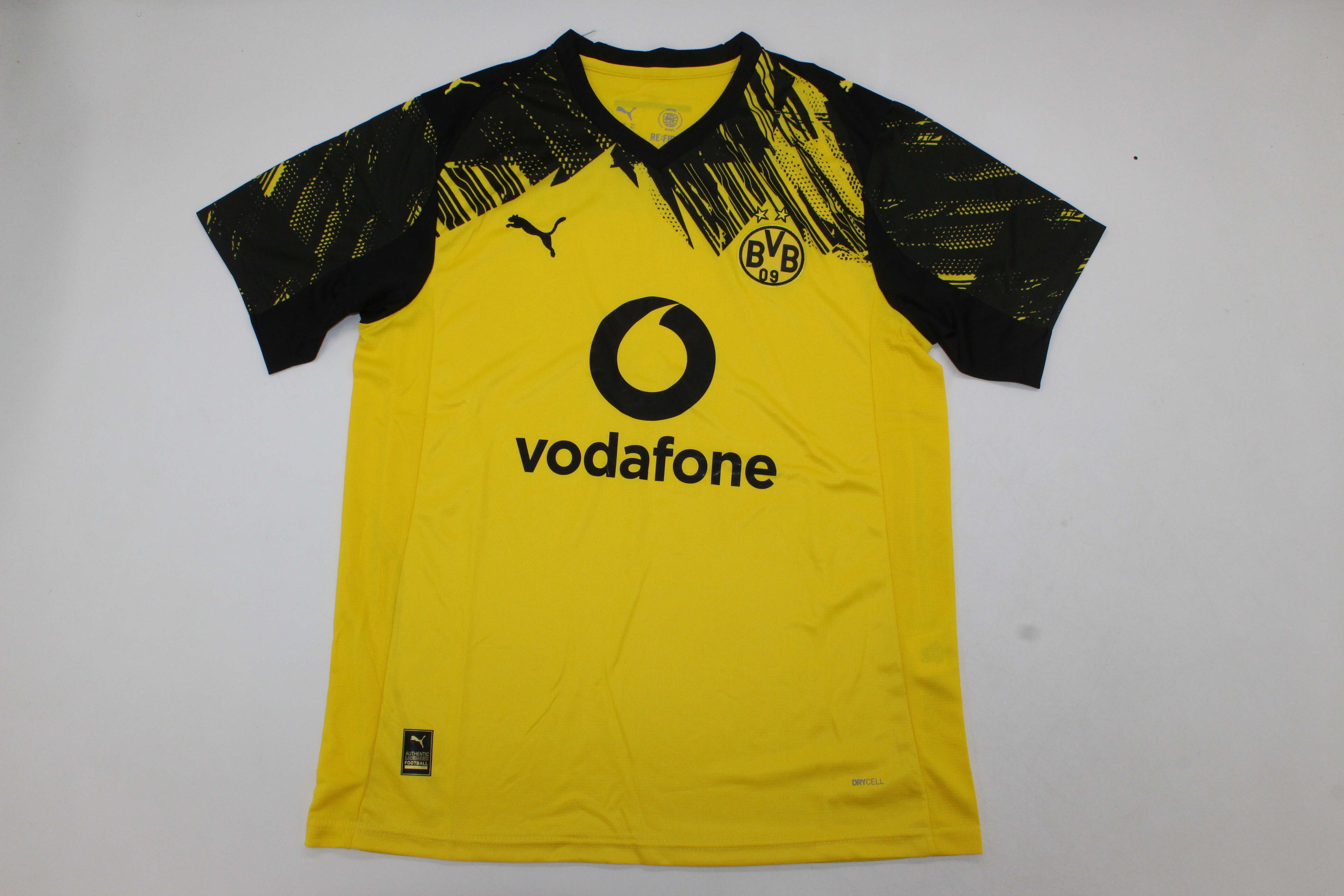 B. Dortmund jersey front view in black and yellow design with official BVB crest.
