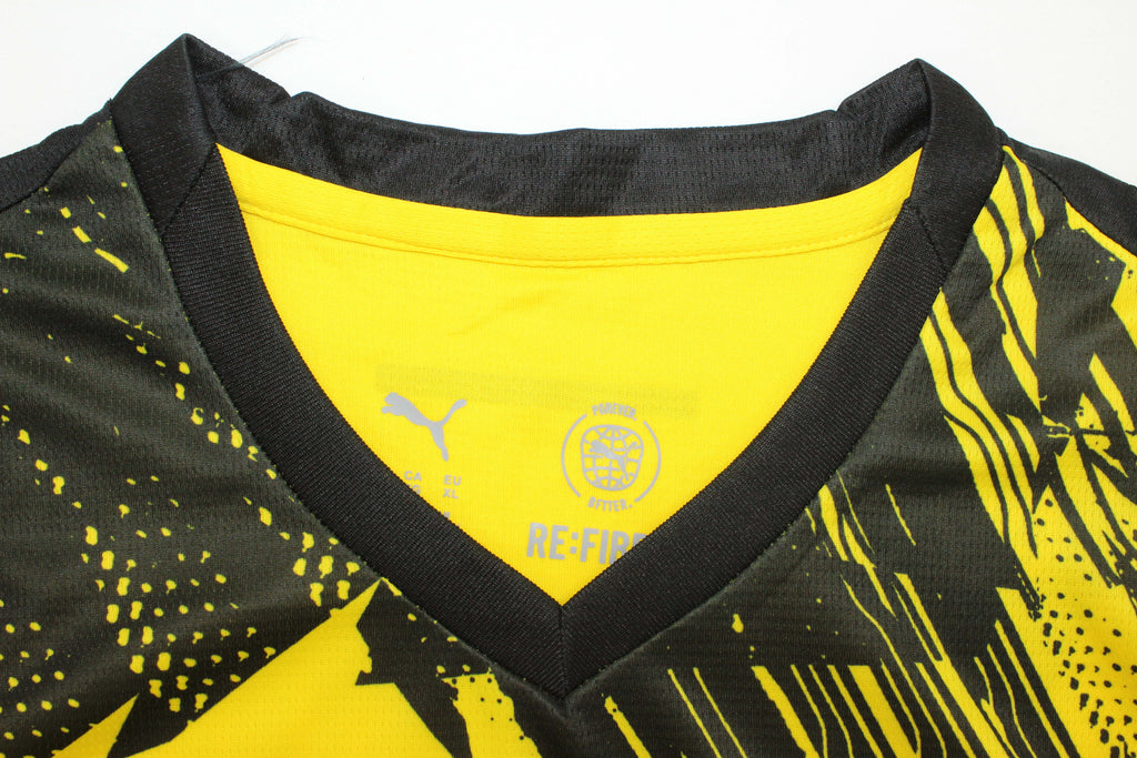 Borussia Dortmund football jersey close-up showing logo and team details