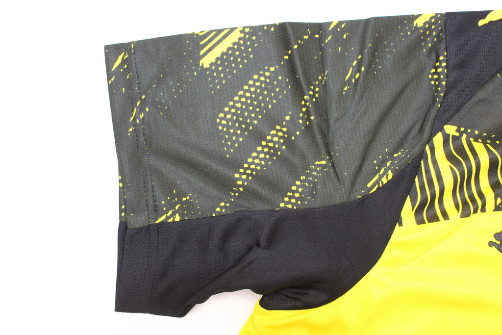 Model wearing B. Dortmund soccer shirt during outdoor training session.